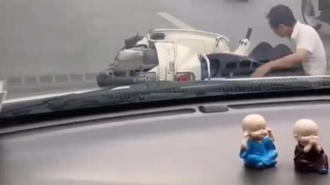 Drunk man drives motorbike in front of my car