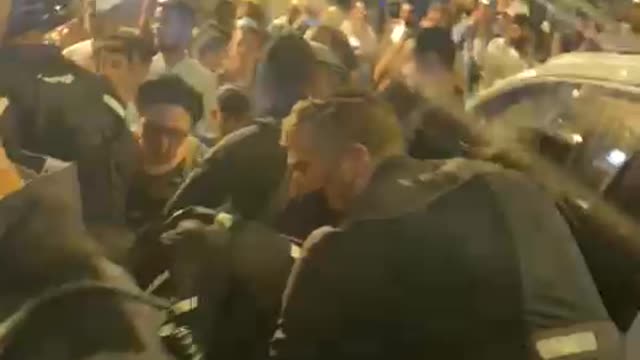 Gestapo violently arresting a demonstrator in Jerusalem