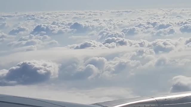 Blue sky and clouds-inside an airplane