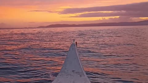 Chasing the Sunrise with a small boat.