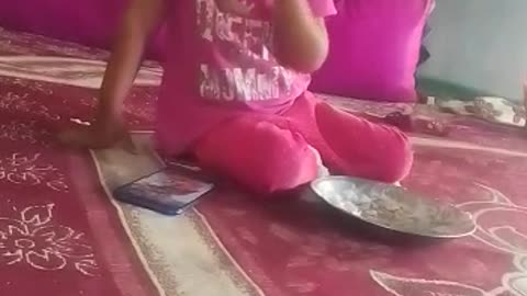 Little girl eating food.