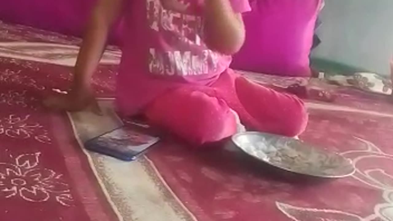 Little girl eating food.