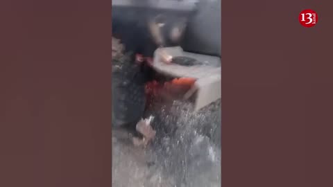 Russian servicemen show the burning, destroyed equipment and trucks in Ukrainian steppes