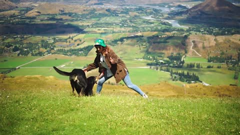 Woman playing with dog