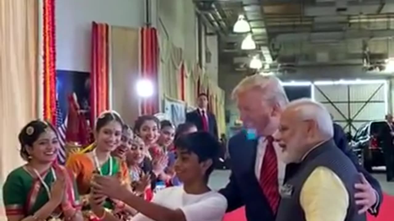 Donald Trump & Indian prime minister interacting with a group of youngster