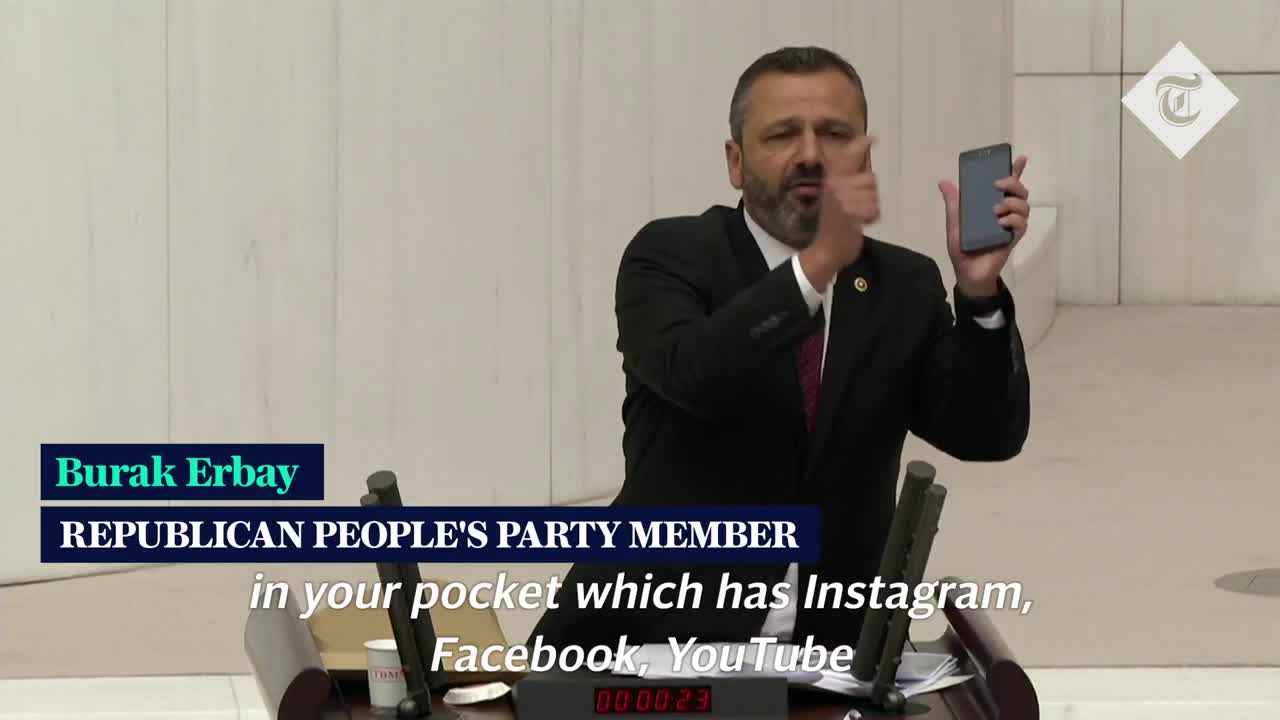 Turkish lawmaker smashes phone with hammer in parliament to protest social media bill