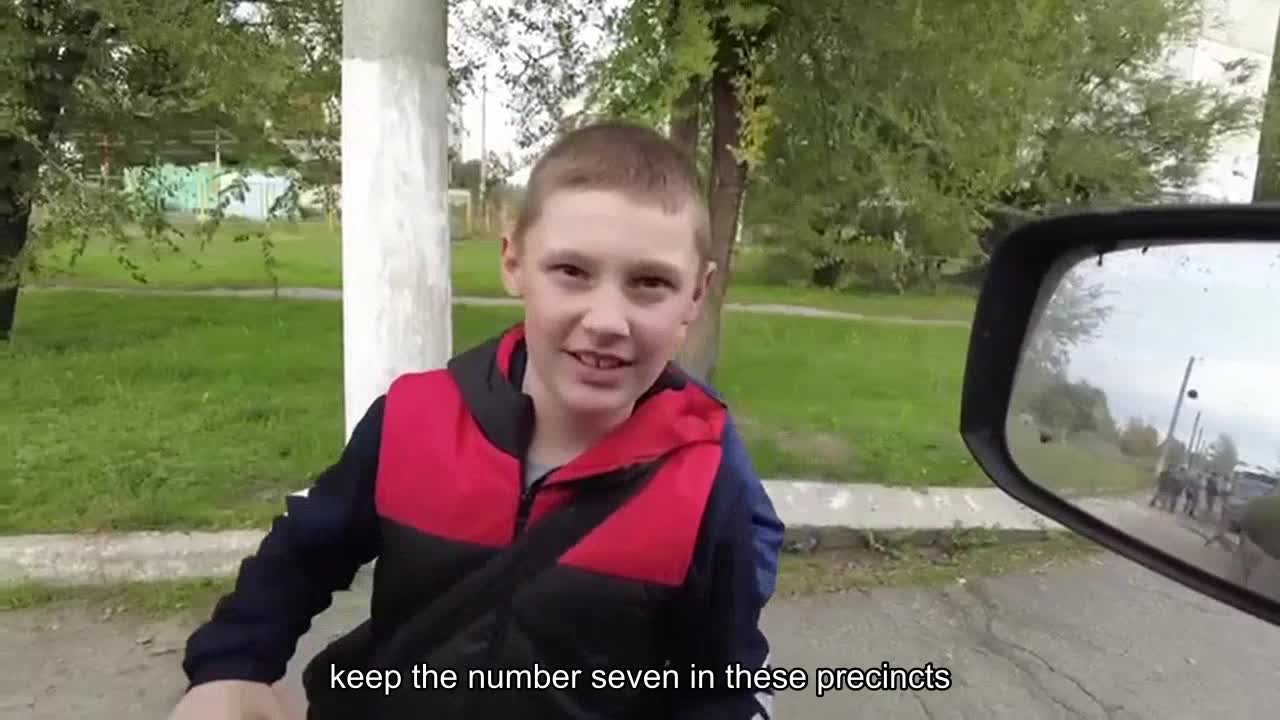 Children run out to meet Ukrainian troops in the liberated village of Kivsharivka in Kharkiv Oblast