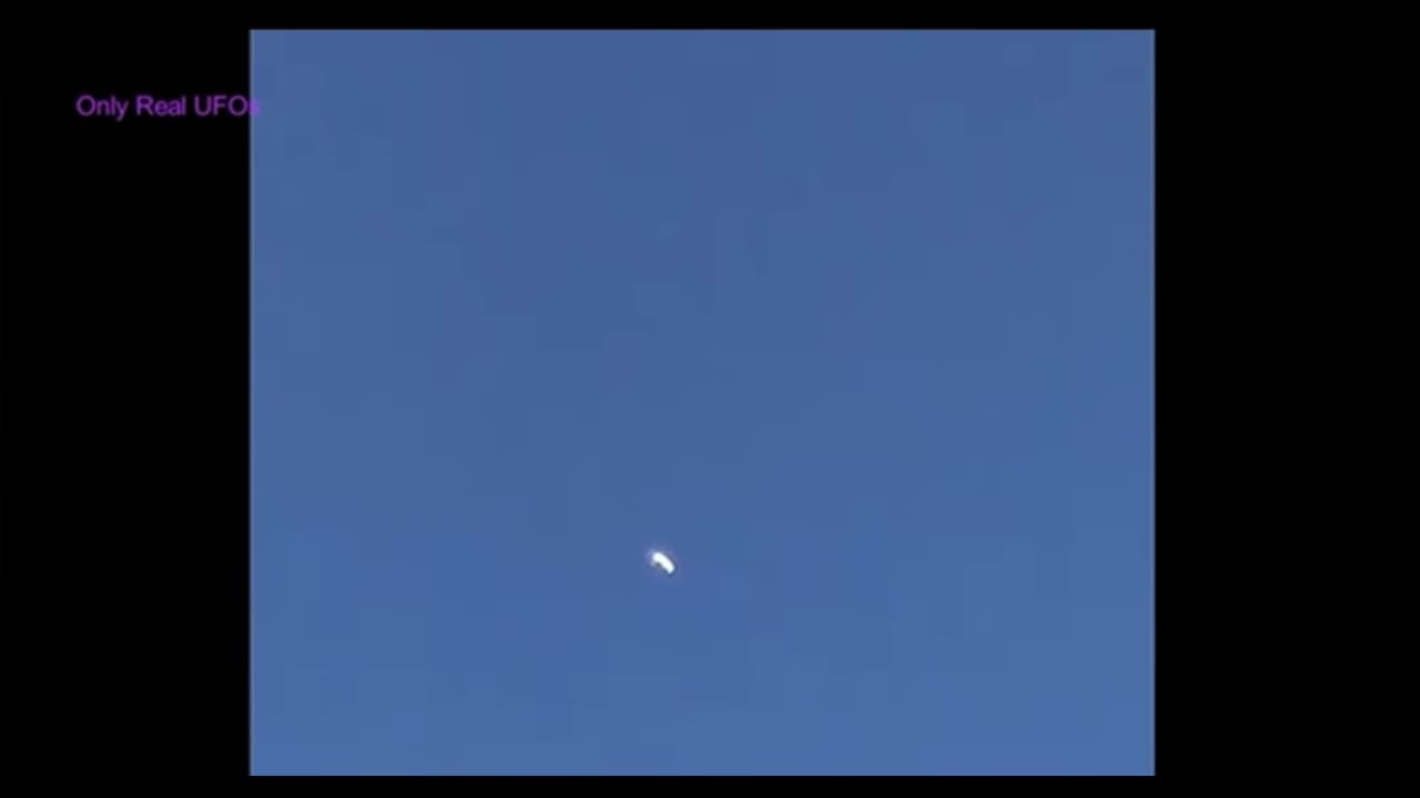 Dark V-shape turns into a saucer-shaped UFO - Manchester, UK