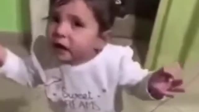 Cute baby argues with father