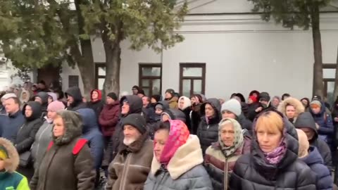 The Orthodox Christian people of Kiev gather outside of the Lavra monastery...