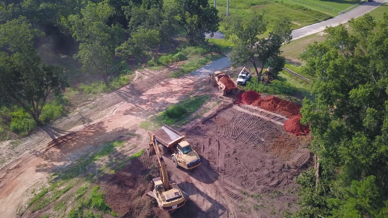 Cat Excavators and Cat Trucks Moving Dirt 4K