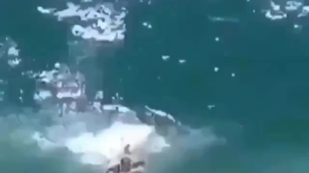 This guy tries catching a huge wave and fails miserably