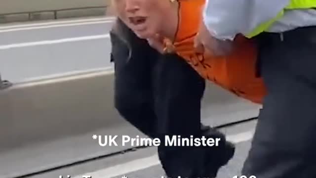 Climate Protester Gives Surprisingly Zen Interview While Being Dragged Away by Police