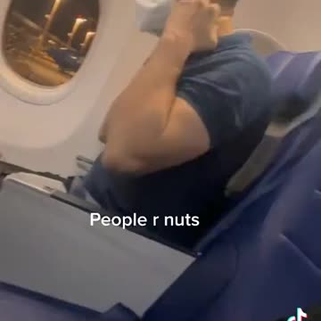 Fellow on a Plane Puts on Six Masks