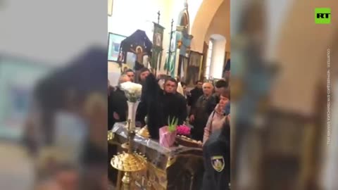 Ukrainian police arrest priest during service