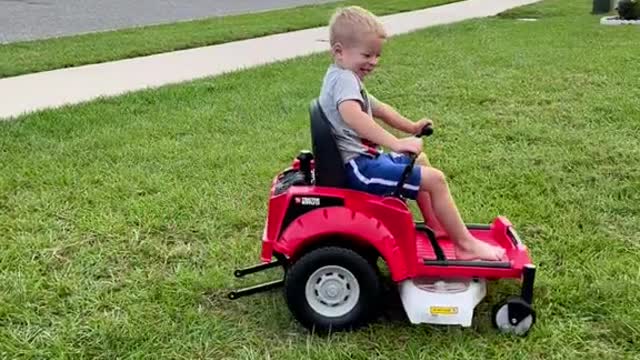 KO0His obsession with the lawn mower just got worse..but now he has his own