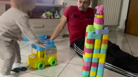 Bulldozer Baby Knocks Over Daddy's Tower