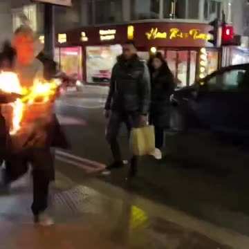 Man on fire in London the worlds going crazy