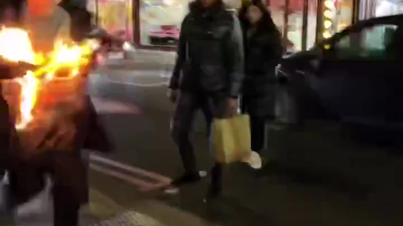 Man on fire in London the worlds going crazy
