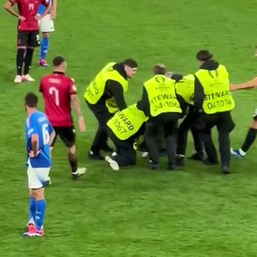 Albanian fan enters the pitch during Albania vs Italy
