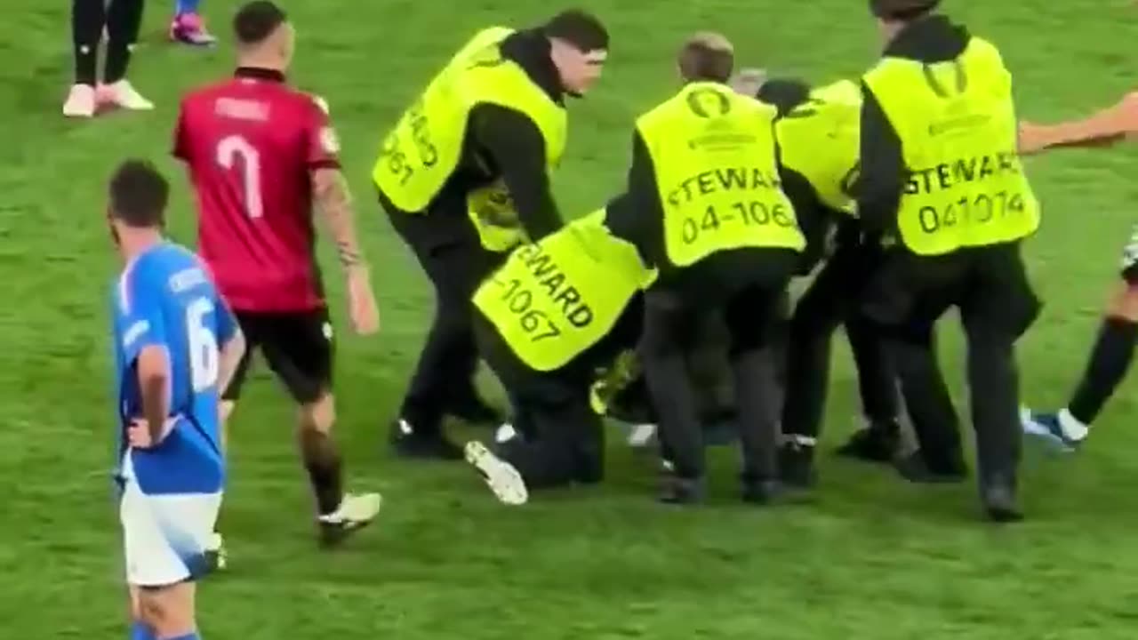 Albanian fan enters the pitch during Albania vs Italy