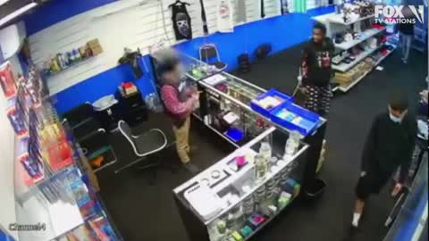 VIDEO: Gun battle breaks out between store employee and would-be robbers