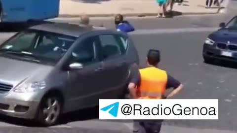 The African whips a policeman with his belt in Rome.