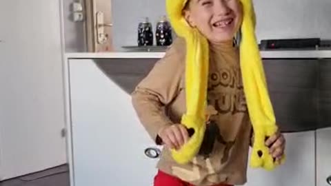 Boy wearing a baby Pikachu hat