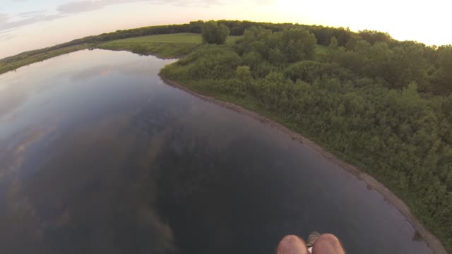 Paramotor Action Along River and Field