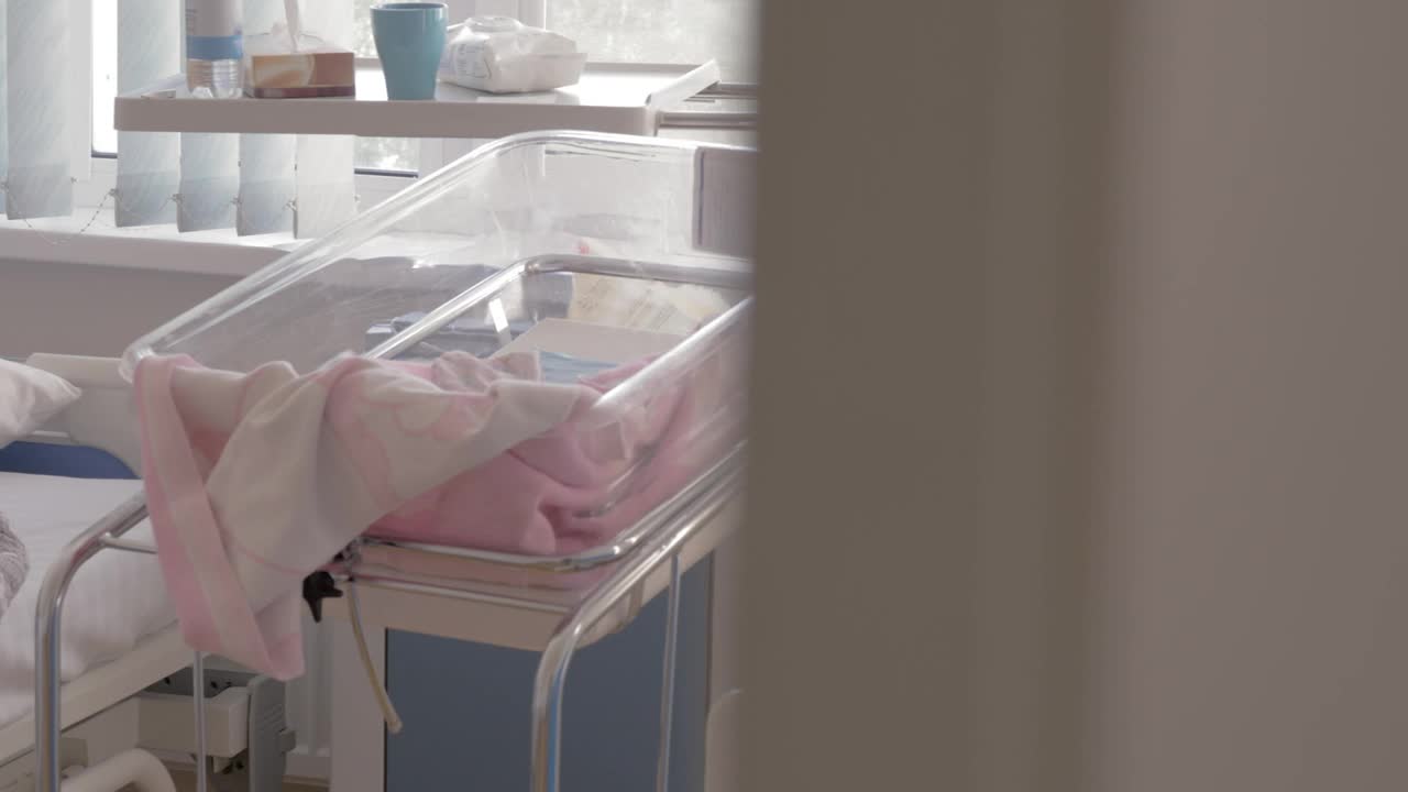 Mother sleeping in a Maternity Ward