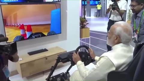 PM Modi driving a car in Europe while seated in India through 5G network