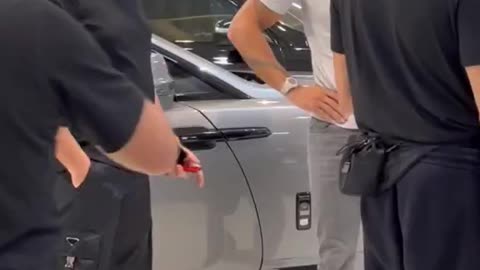 Tate buys a ferrari