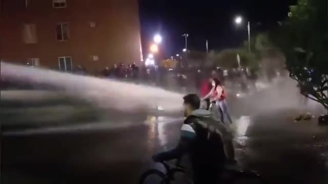 Look at the force of a water cannon used by the police