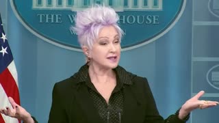 Cyndi Lauper gives a speech in the White House briefing room