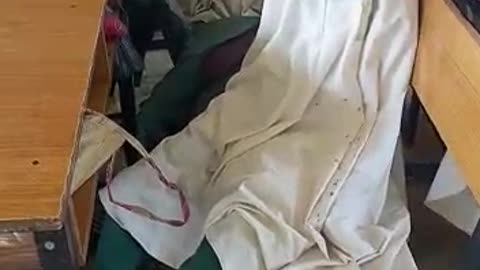 A physically challenge writing with her feet