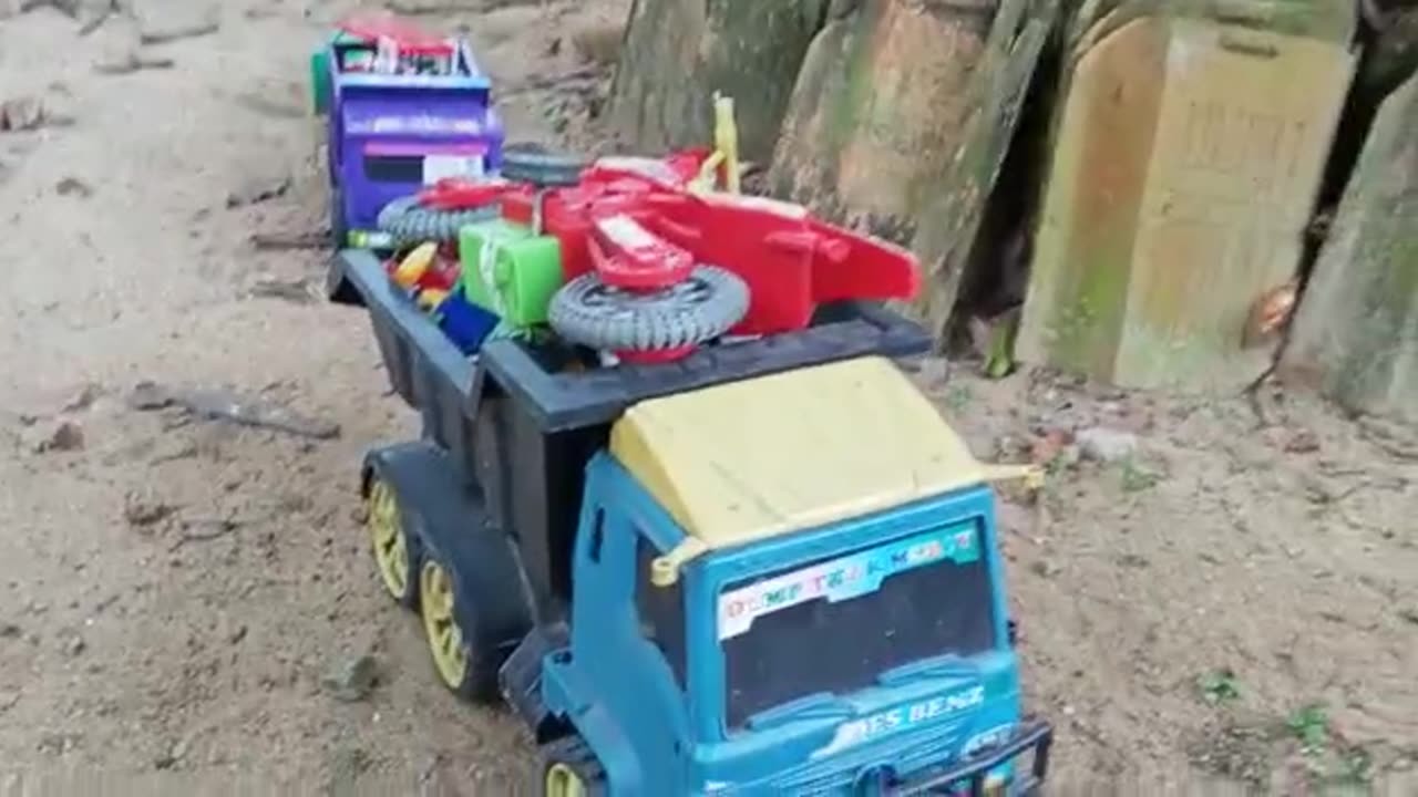 transport various toys using three toy truck cars