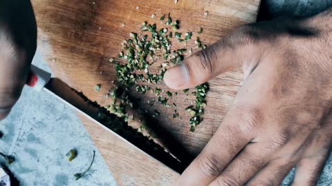 Cutting Green Chillies In Small Sizes