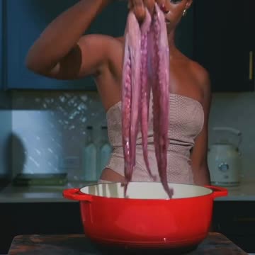 How to cook an Octopus. Beautiful lady seen show us how she cooks he red Octopus