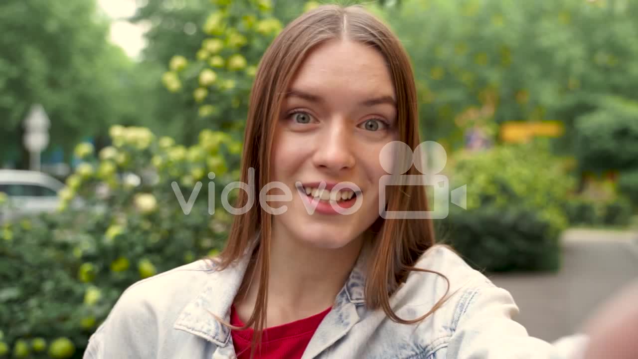 Pretty Young Woman Having A Video Call, Waving Hand At Camera Smiling 1