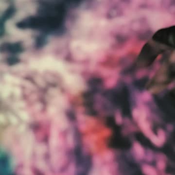 A hand with an image of a projected nebula