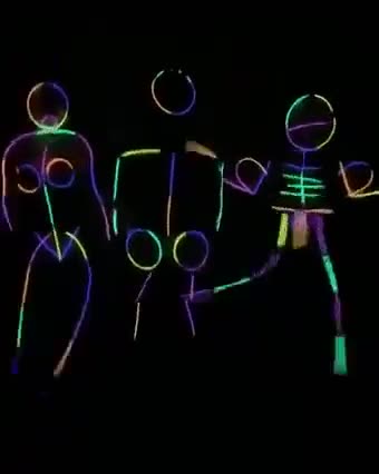 Girls perform neon light dance