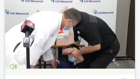 NURSE TAKES VACCINE PASSES OUT.