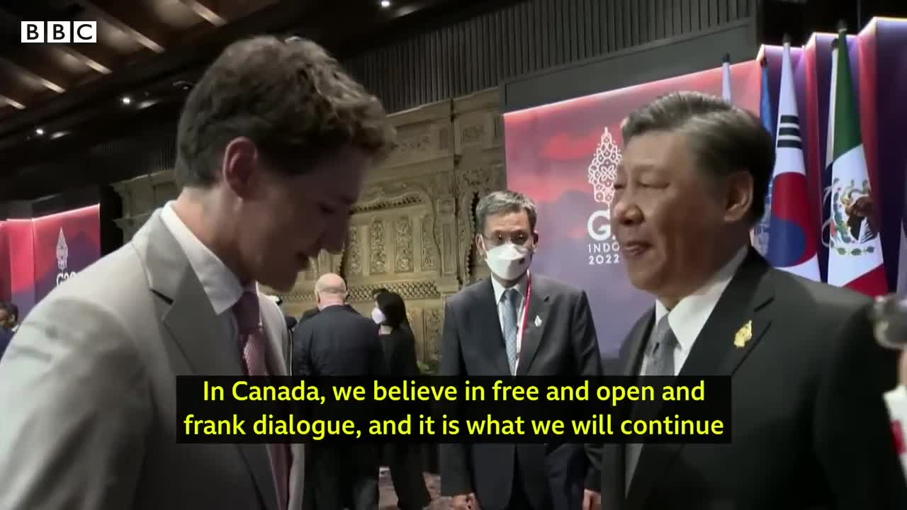 China and Canada leaders caught having tense exchange on camera - BBC News