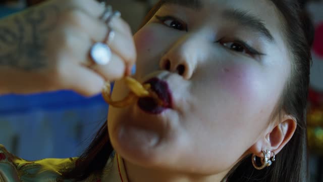 Cute Chinese woman devouring noodles