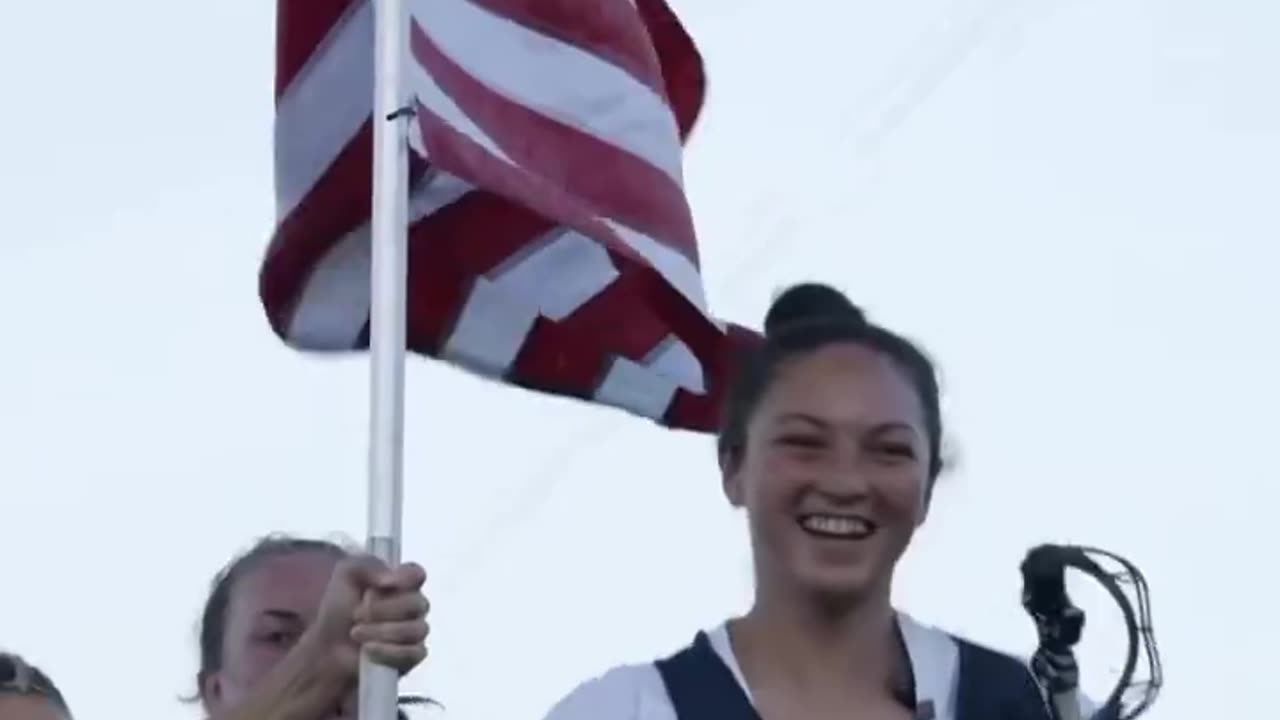 Navy women’s lacrosse team sings 'Courtesy of the red white and blue' by Toby Keith.