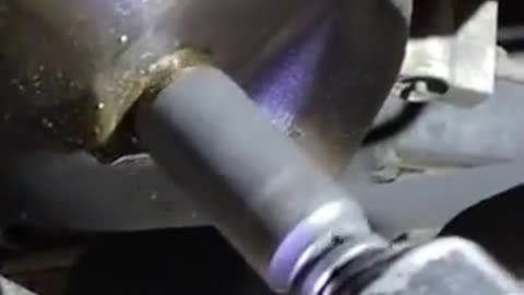 Remove the oil drain repair tool.