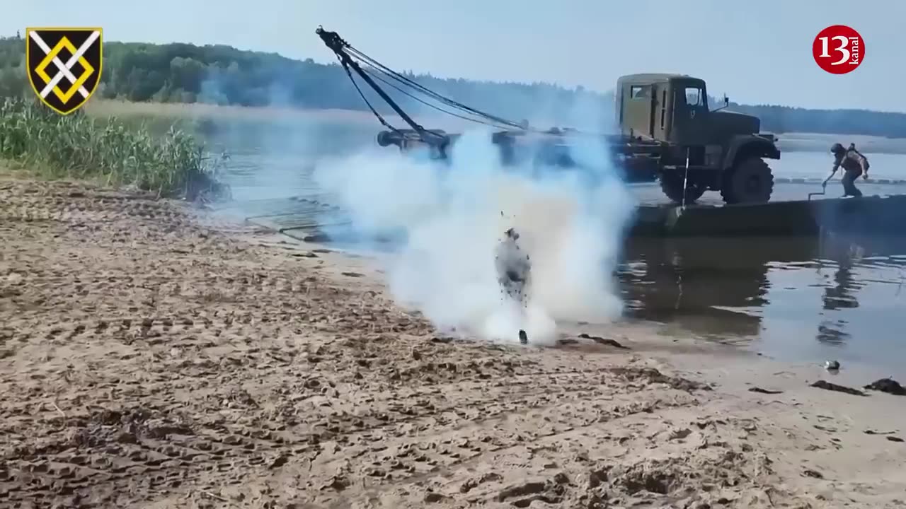 ukrainian army prepares for attack by crossing heavy equipment
