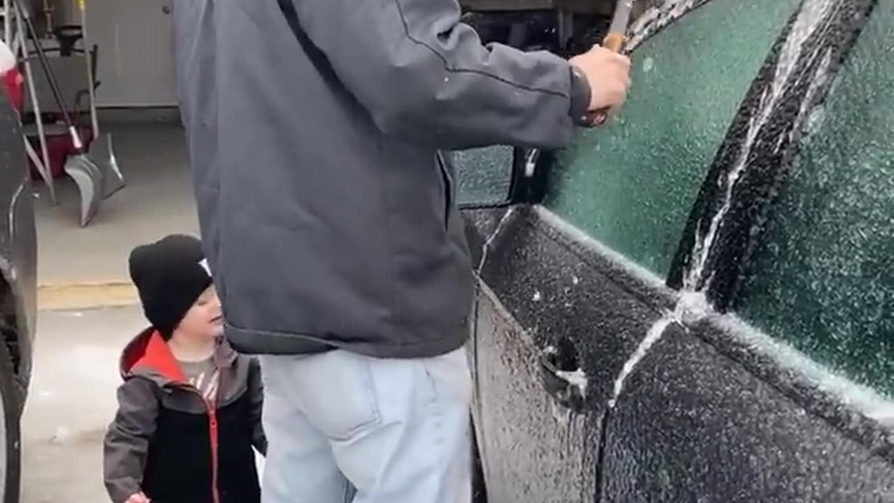 USING A HAMMER TO OPEN A FROZEN CAR DOOR