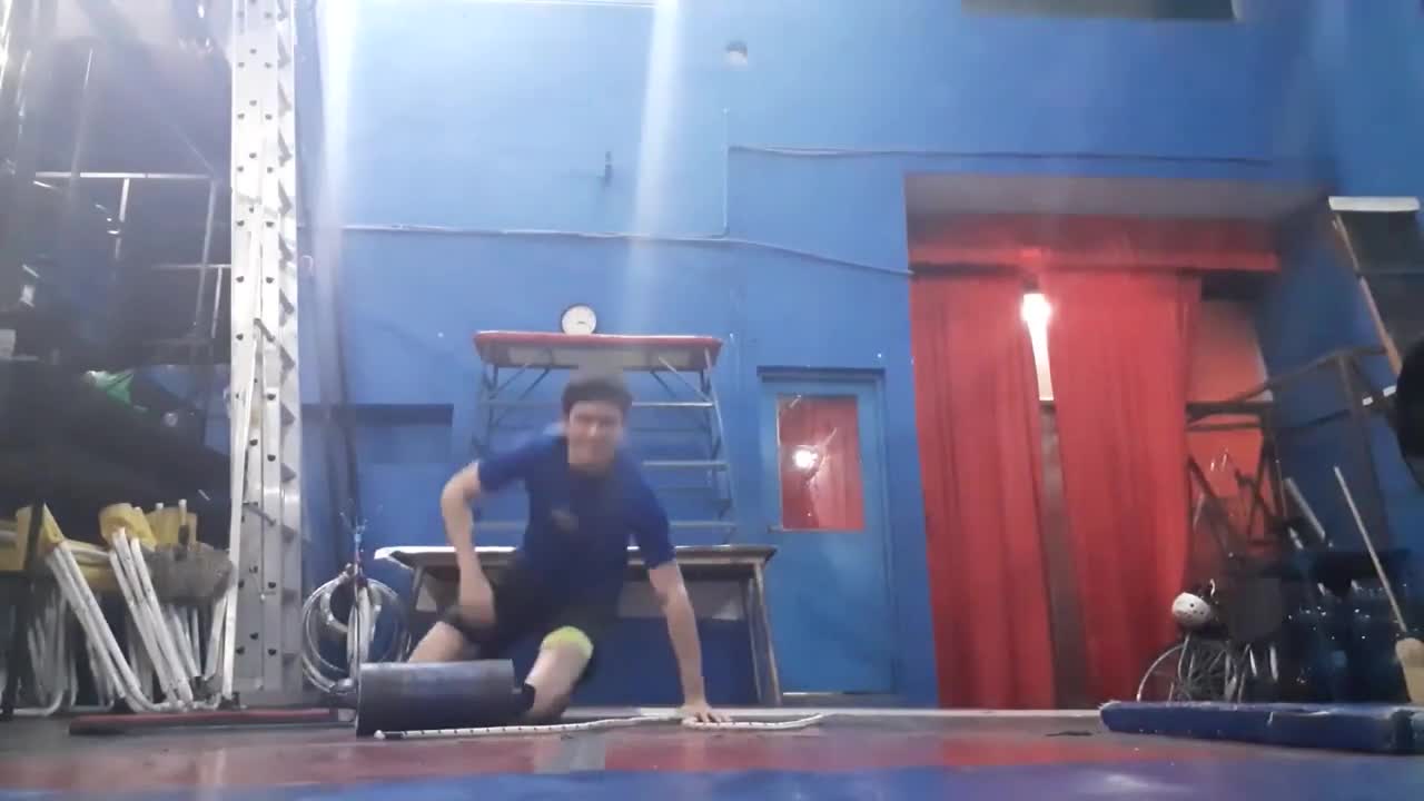 Young Man Attempting A Stunt, Falls Right On His Side