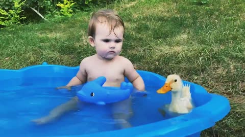 Cute baby playing with duck 🦆